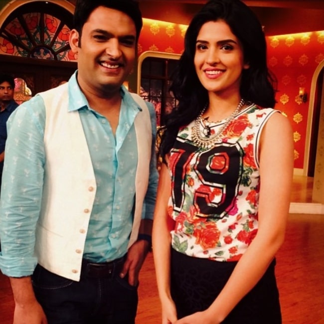 Deeksha Seth as seen in a picture with comedian Kapil Sharma in June 2014