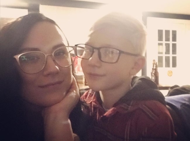 Erin Wagner smiling for a picture alongside Jaxon Bieber in December 2019