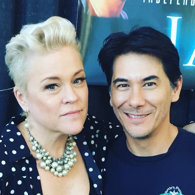 James Duval smiling for a picture alongside Christine Elise McCarthy at Burbank Marriott Convention Center in September 2018