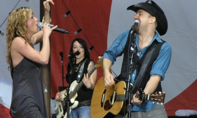 Jennifer Nettles and Kristian Bush (foreground) with Annie Clements (background) perform at MyCokeFest at Centennial Olympic Park in Atlanta, Georgia in April 2007