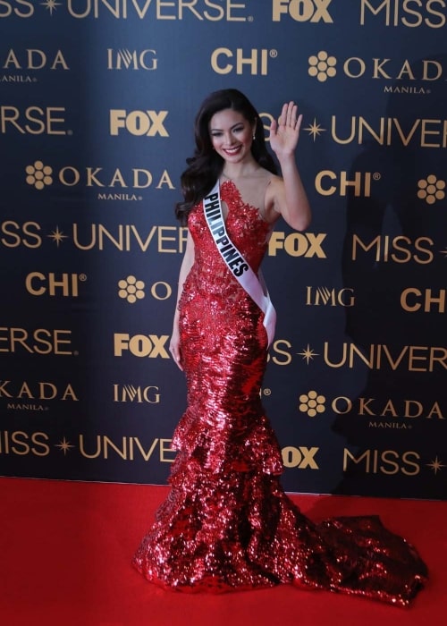 Miss Universe Philippines Maxine Medina waves to the media during the Miss Universe Red Carpet event on January 30, 2017, at the SMX Convention Center in Pasay City