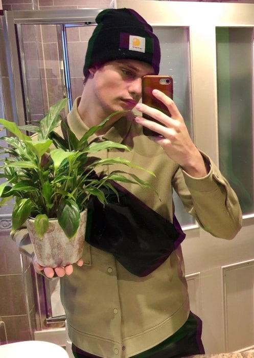 Nicholas Galitzine busy with potted plants in January 2020