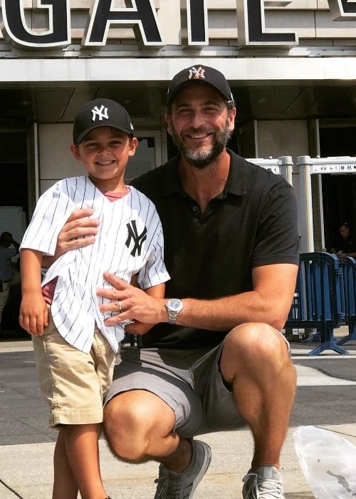 Andrew Form smiling for a picture alongside his son Julian in an Instagram post in September 2020