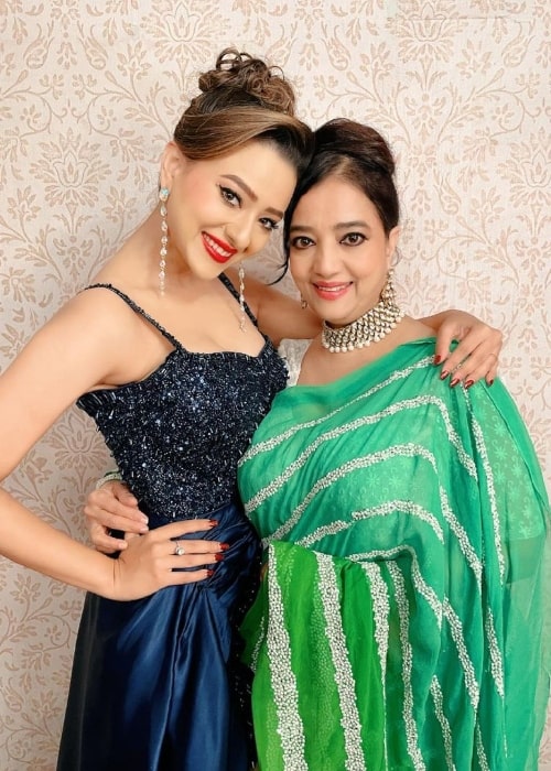 Madalsa Sharma smiling for a picture alongside her mother Sheela Sharma