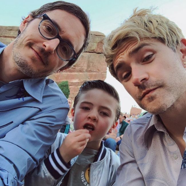 Matt (r) as seen with his husband and son in 2019