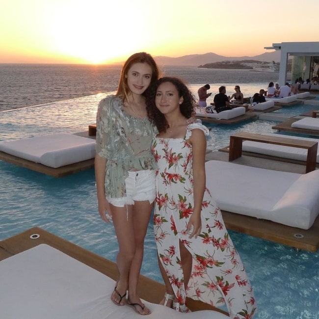 Nicole Elizabeth Berger (Left) and her friend Olivia posing for a picture in Greece