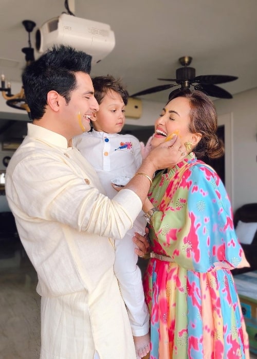 Nisha Rawal as seen while smiling in a Holi picture with Karan Mehra and their son in March 2021