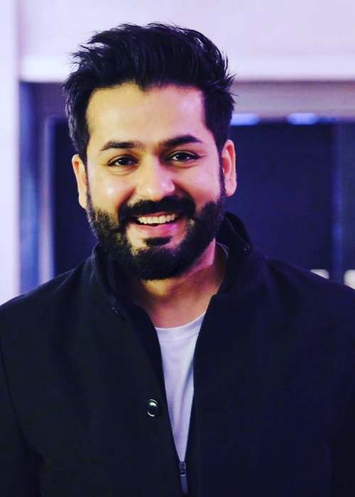 Aditya Dhar as seen smiling in 2019