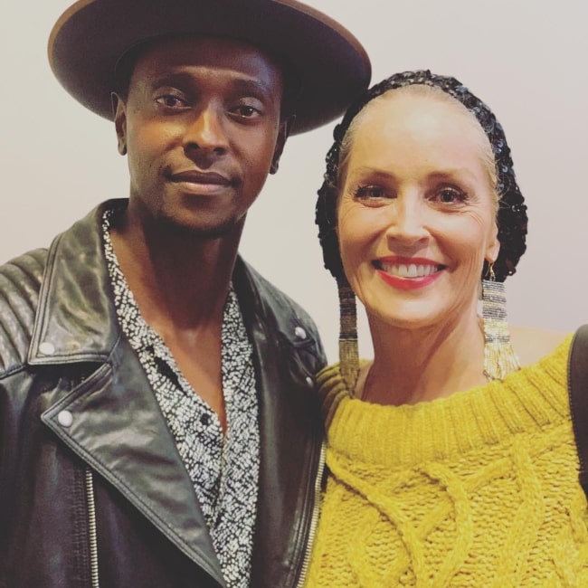 Edi Gathegi and Sharon Stone in November 2018