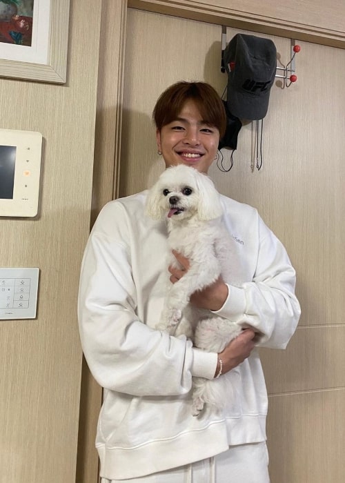 Ju-ne as seen in a picture with his dog that was taken in June 2021