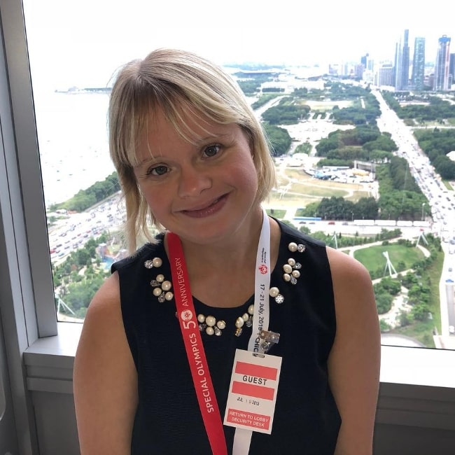 Lauren Potter smiling for a picture in Chicago, Illinois in July 2018