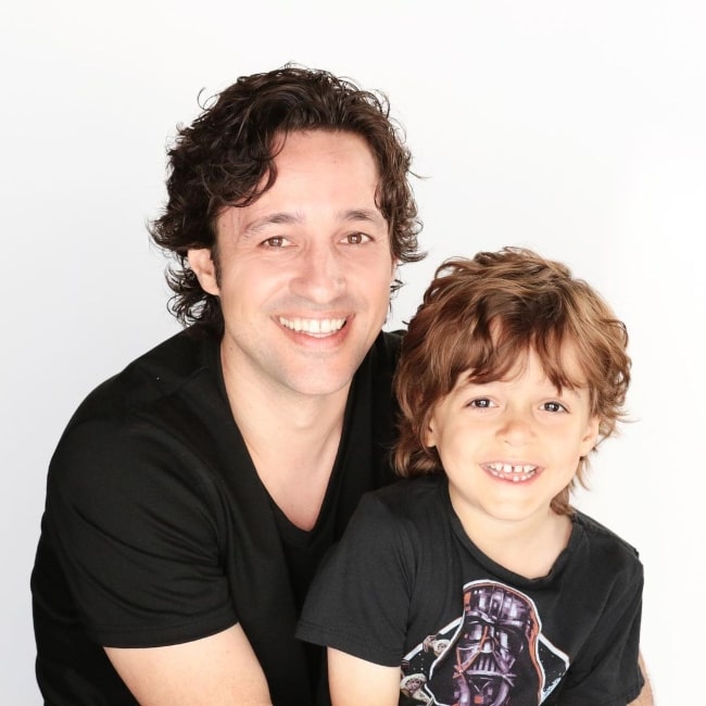 Nolan River smiling for a picture alongside his father Thomas Nicholas