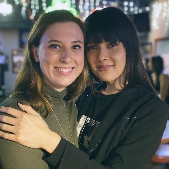 Patti Harrison (Right) smiling for a picture in 2020