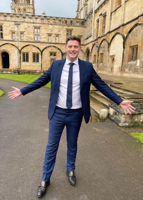 Alex George posing for a picture at Oxford University in August 2021