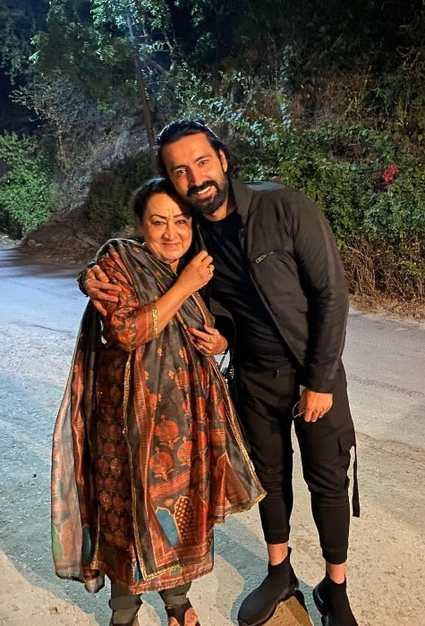 Karan Nath smiling in a picture alongside his mother in May 2021