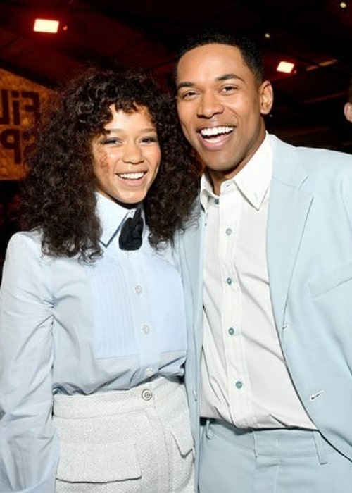 Kelvin Harrison Jr. smiling in a picture with Taylor Russell