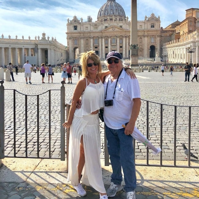 Mary-Margaret Humes and her husband Raul A. Bruce posing for the camera at Saint Peter's Square in Vatican City in 2018