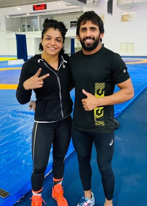 Sakshi Malik as seen in a picture that was taken in August 2021, with fellow wrestler Bajrang Punia