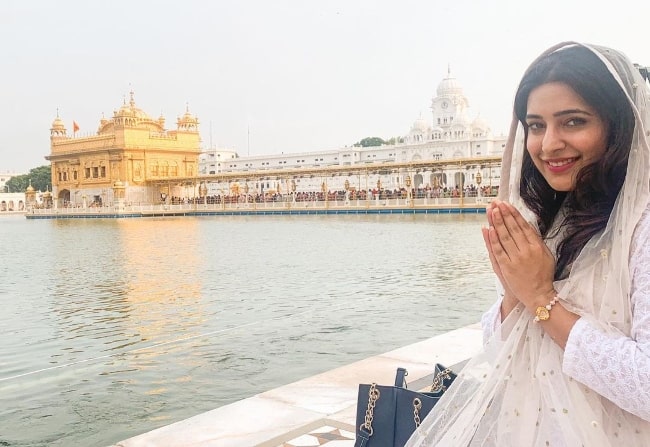 Shiny Dixit smiling for a picture at Golden Temple in Amritsar, Punjab in 2021