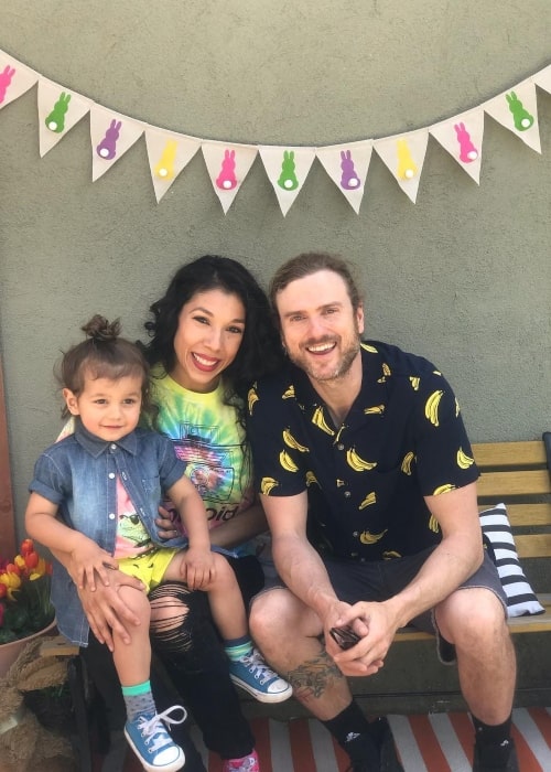 Ashlee Nino as seen in a picture with bassist Joey Clement and their son Zephyr in April 2019