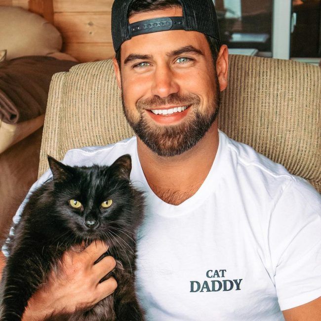 Blake Moynes as seen posing with his pet cat in 2021