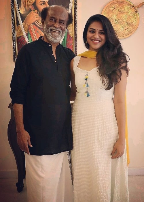 Indhuja Ravichandran posing for a picture with Rajinikanth