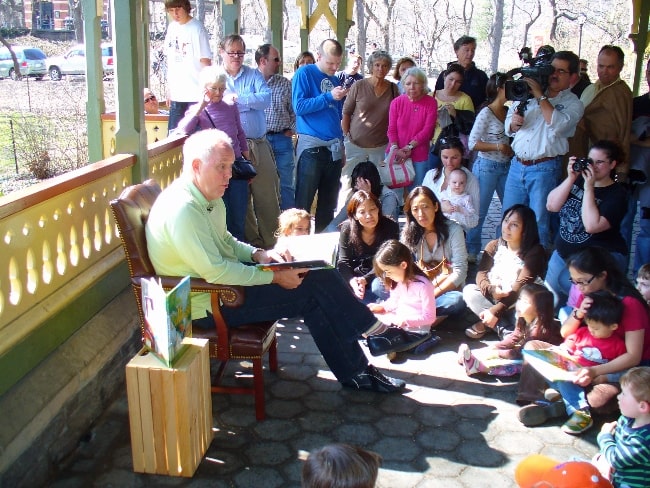 John Lithgow pictured while reading a book to children in 2007