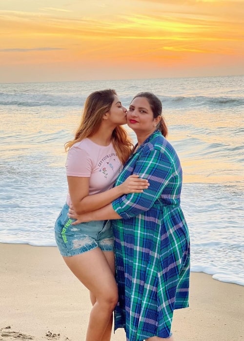 Shivani Narayanan posing for a picture with her mother while enjoying a sunset