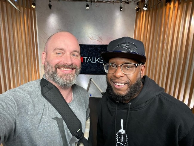 Tom Segura (Left) as seen while taking a selfie with Talib Kweli in July 2021