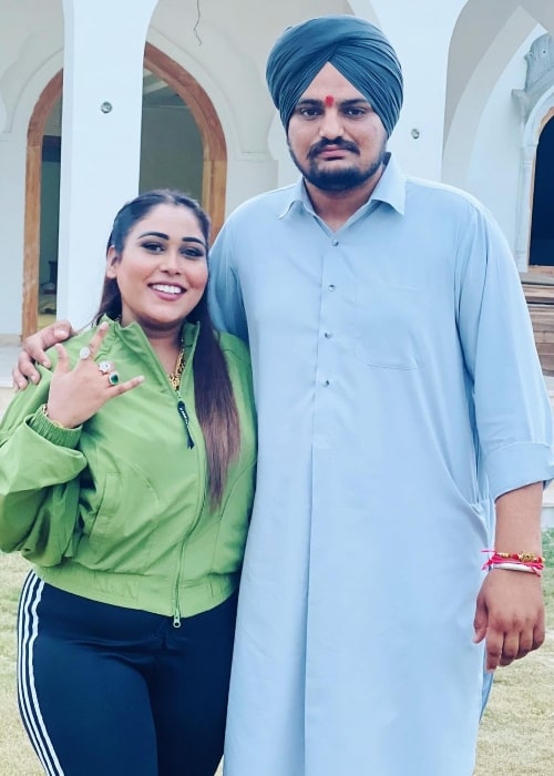 Afsana Khan posing for a picture alongside Sidhu Moose Wala in Chandigarh, India