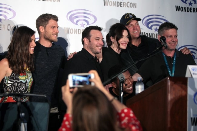 From Left to Right - Marissa Neitling, Travis Van Winkle, Hank Steinberg, Bridget Regan, Jocko Sims, Adam Baldwin, and Steven Kane at the 2016 WonderCon, for 'The Last Ship', at the Los Angeles Convention Center