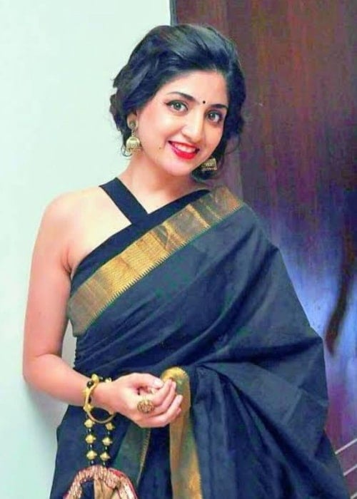 Poonam Kaur as seen while smiling for a picture