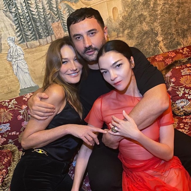 Riccardo Tisci as seen in a picture that was taken with Mariacarla Boscono and Carla Bruni in October 2021