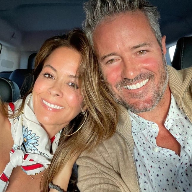 Scott Rigsby smiling in a picture alongside Brooke Burke in Los Angeles, California in May 2021