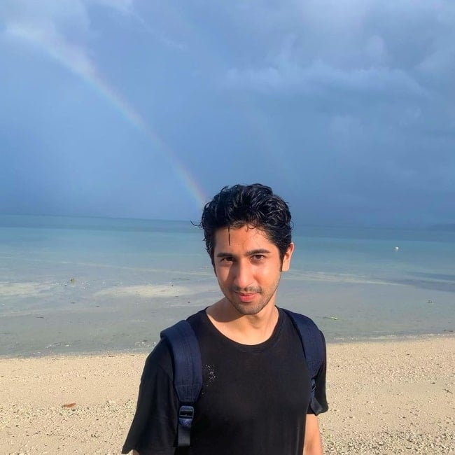 Vihaan Samat as seen while posing for a picture with a rainbow in the background