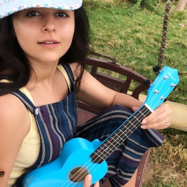 Yesha Rughani in June 2020 having a beautiful time playing the ukulele