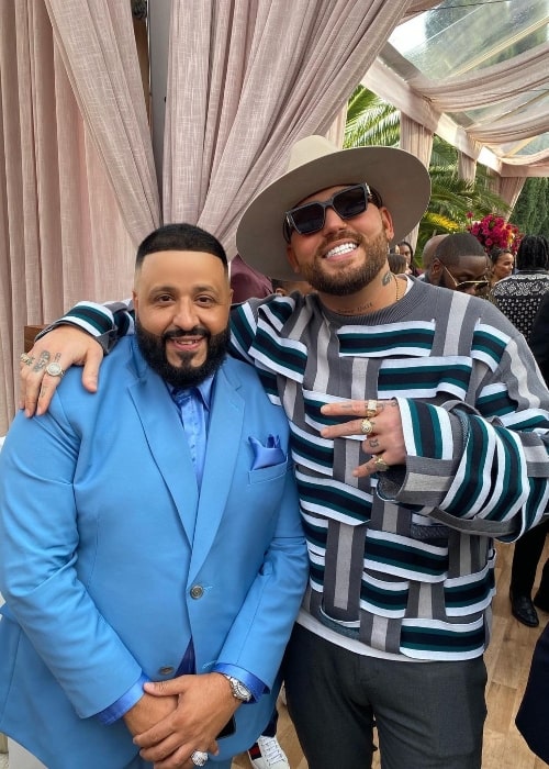 Gashi (Right) smiling for a picture alongside DJ Khaled in Los Angeles, California in January 2020