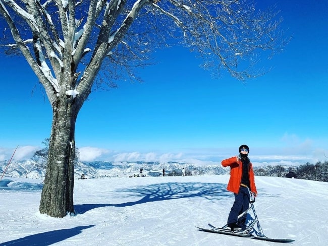 Taishi Nakagawa posing for a picture while enjoying his time in the snow