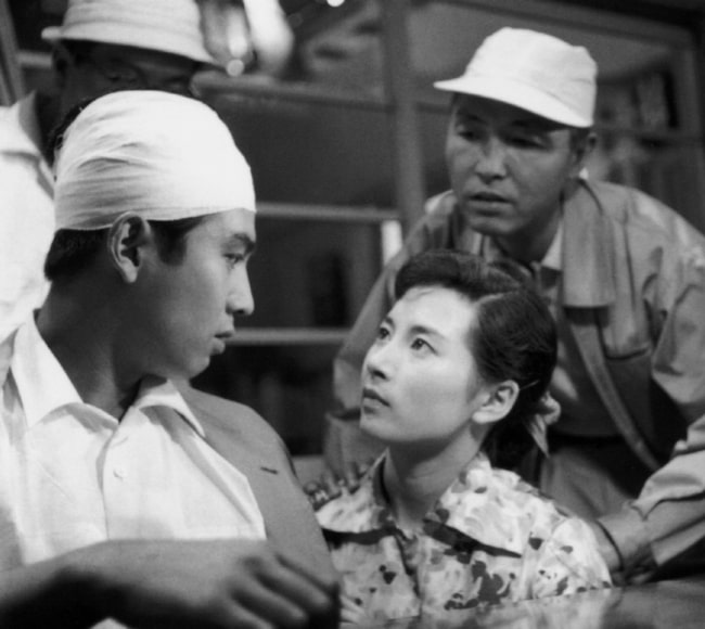 Yumi Shirakawa (Center) with actor Kenji Sahara (Left) and director Ishirō Honda on set of 'Rodan'