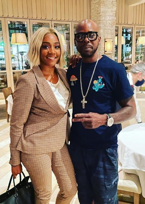 C-Bo posing for a picture alongside Tiffany Haddish in July 2021