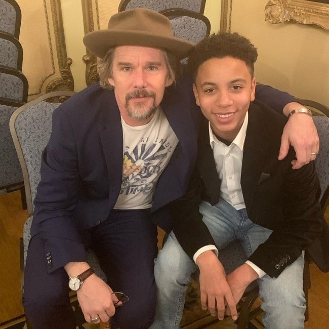 Joshua Caleb Johnson (Right) smiling for a picture alongside Ethan Hawke in 2020