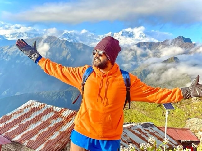 Santhanam posing for a picture