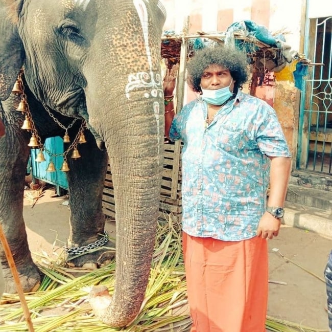 Yogi Babu in July 2021 with the temple elephant