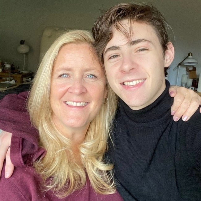 Anton Starkman smiling in a picture alongside his mother
