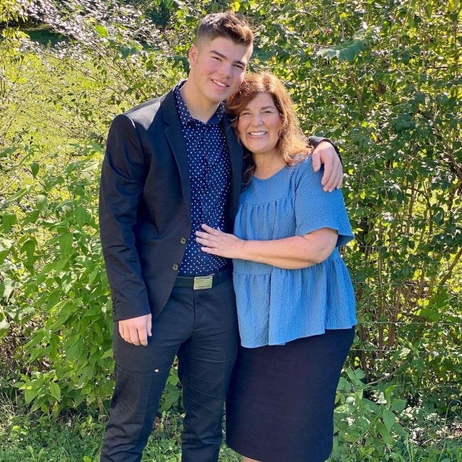 Isaiah Bates as seen in a picture with his mother Kelly Bates in October 2021