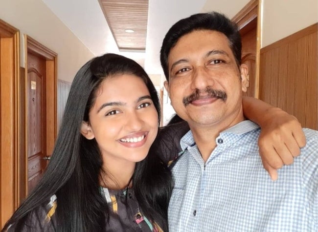 Mamitha Baiju smiling in a picture alongside her father in June 2021