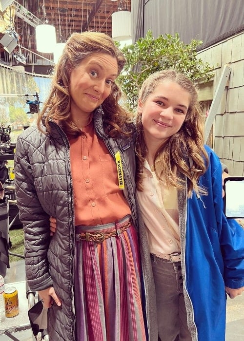 Raegan Revord (Right) smiling for a picture alongside Zoe Perry, Raegan's mother on the show 'Young Sheldon'