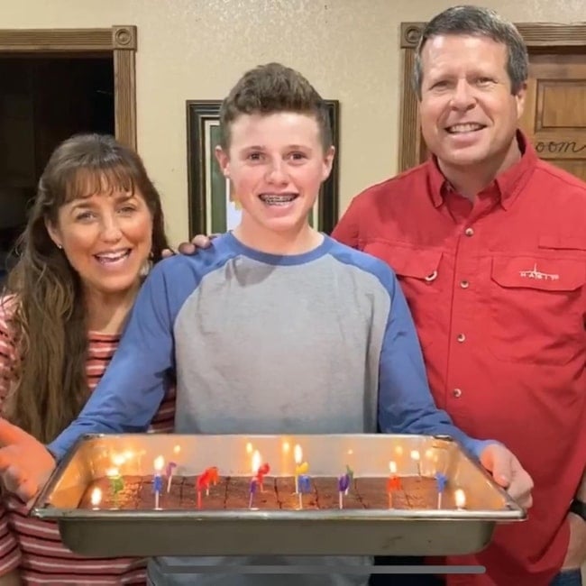 Jackson Duggar and his parents Michelle and Jim Bob Duggar in a picture that was taken in May 2020