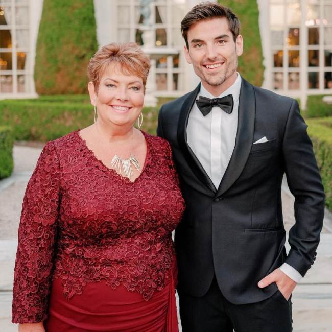 Jared posing with his mother on his wedding day