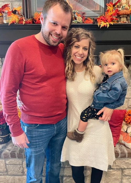 John-David Duggar and his wife Abbie Duggar in a picture with their daughter in Grace Duggar in November 2021